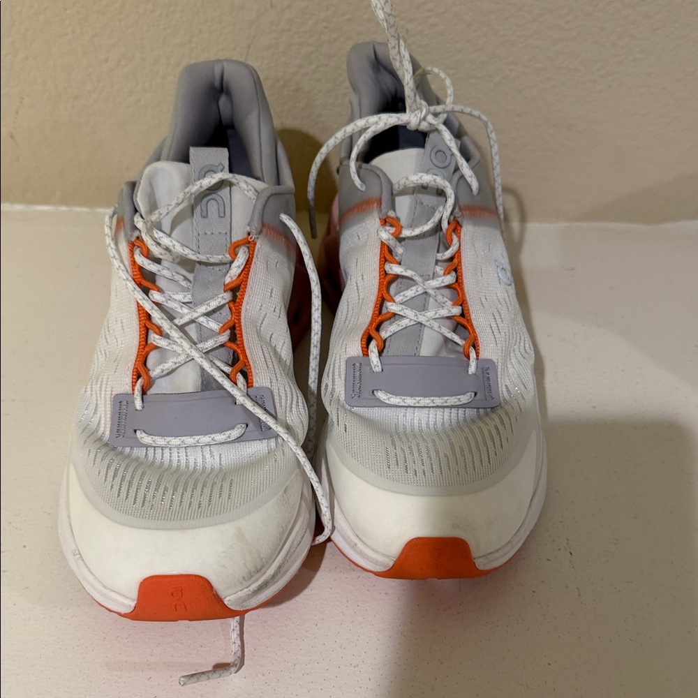On Running White and Orange Women’s Sneakers